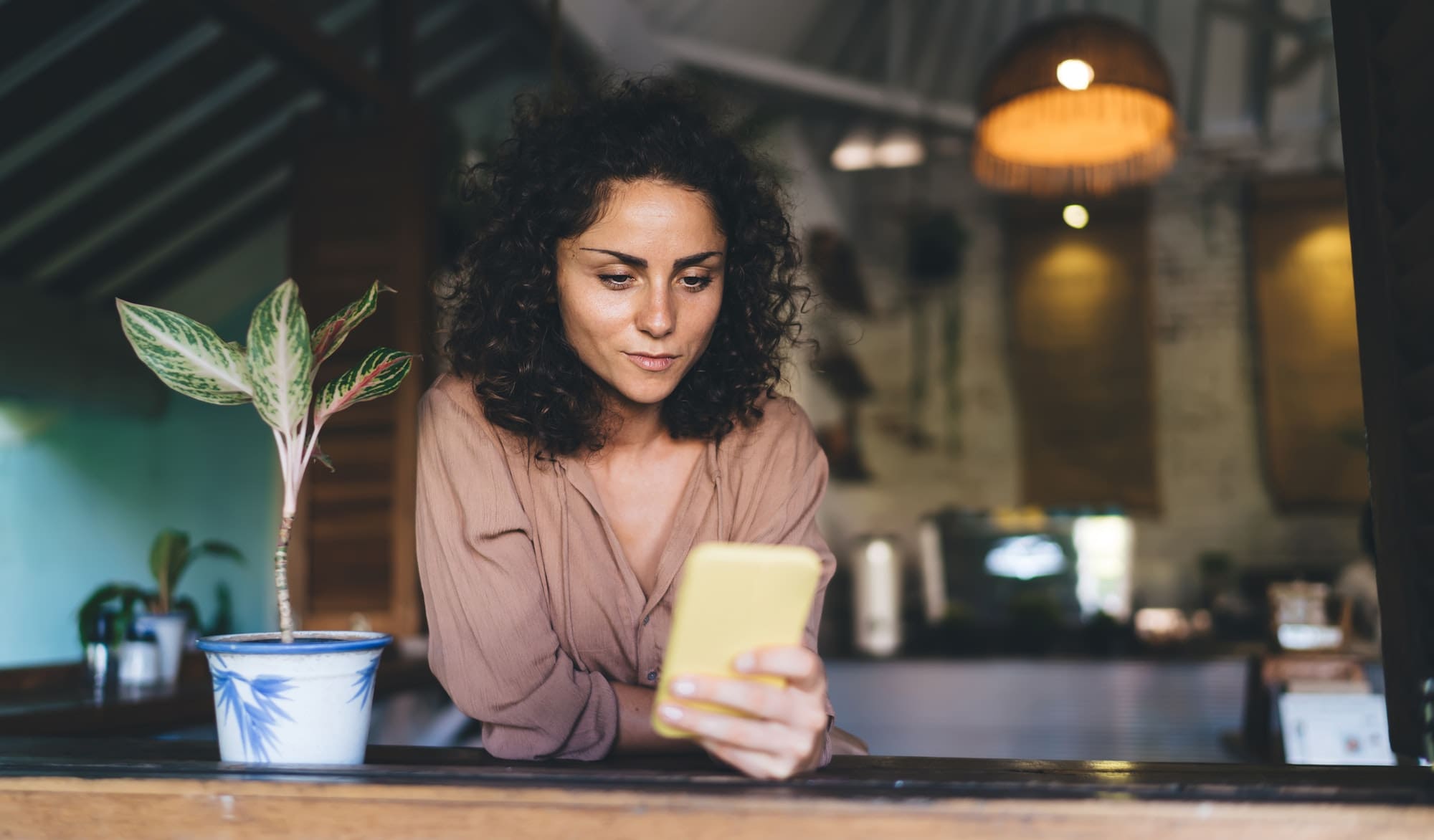 Caucaisan woman reading content publication while networking social media on smartphone