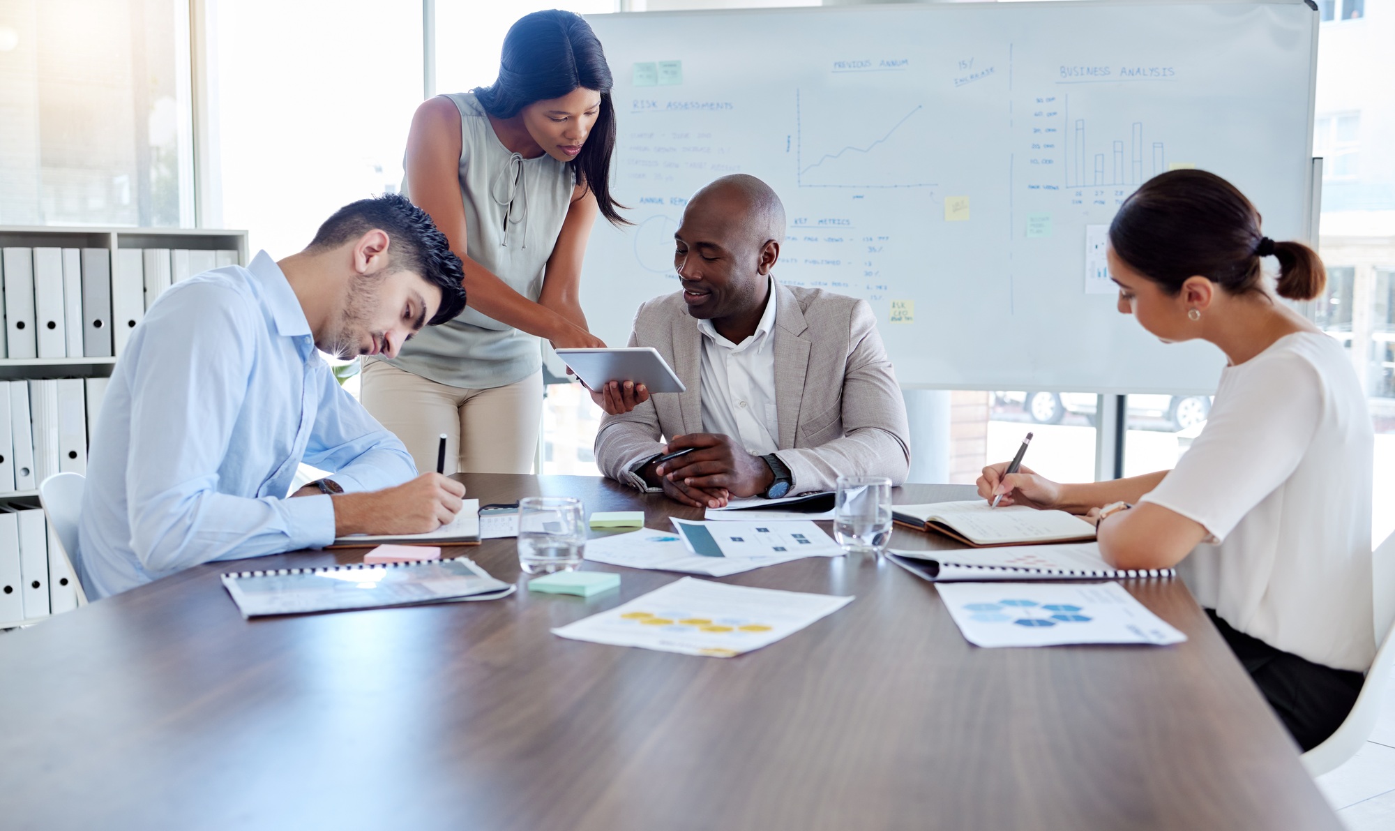 Planning, project management or tablet review with business people in meeting for marketing strateg